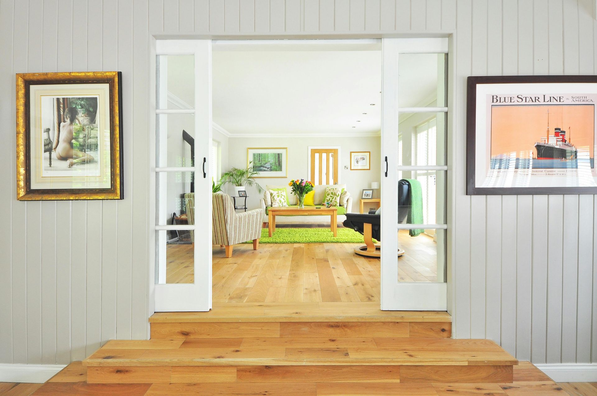 A bright and open living room showcasing contemporary interior design and luxury furnishings.